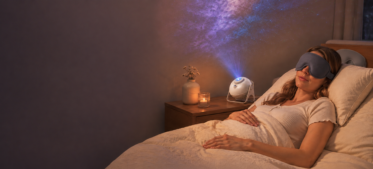 Woman relaxing in bed with a sleep mask beside a softly glowing galaxy projector